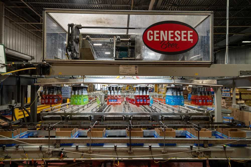 Photo of automated re-pack system filling cases Photo of automated re-pack system filling cases